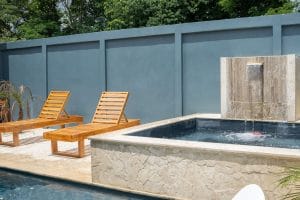 Poolside of your Costa Rica house rentals property Casa Fenix, with jazucci and pool charis.